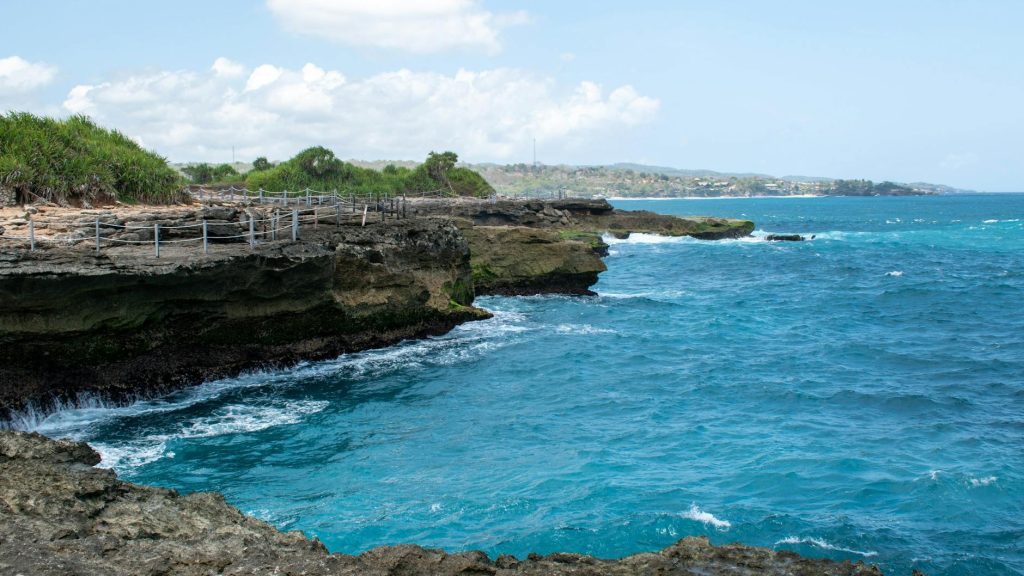 Breathtaking view of the ocean against rocky cliffs in Bali, Indonesia.